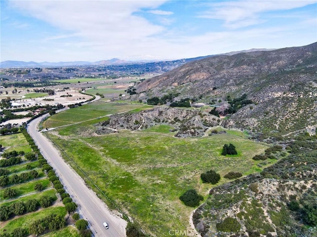 birds eye view of property featuring a mountain view