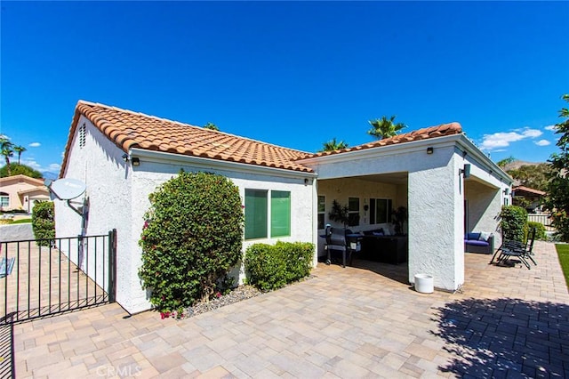 back of house featuring a patio area