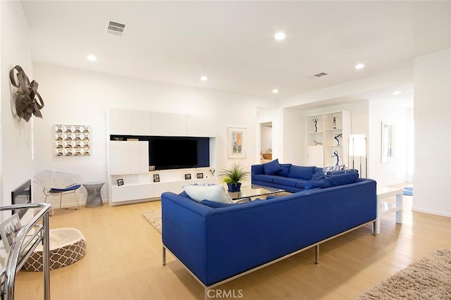 living room with light hardwood / wood-style flooring