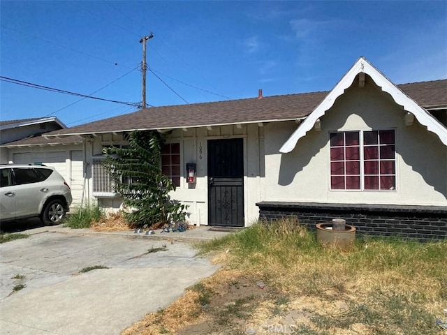 ranch-style house featuring a garage