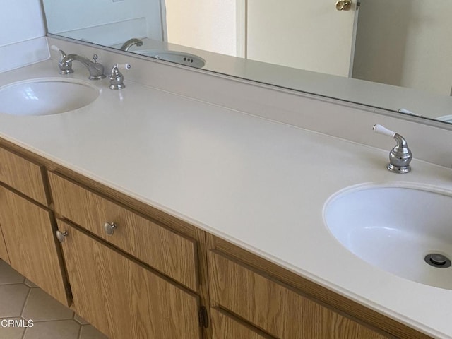 bathroom with tile patterned flooring and vanity