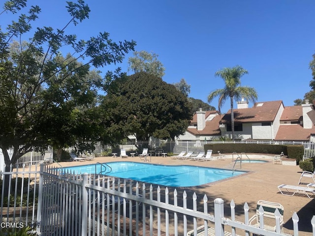 view of swimming pool with a patio area