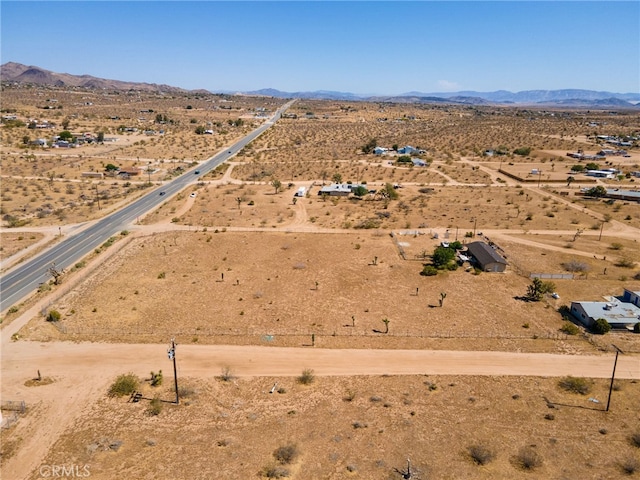 bird's eye view featuring a rural view and a mountain view