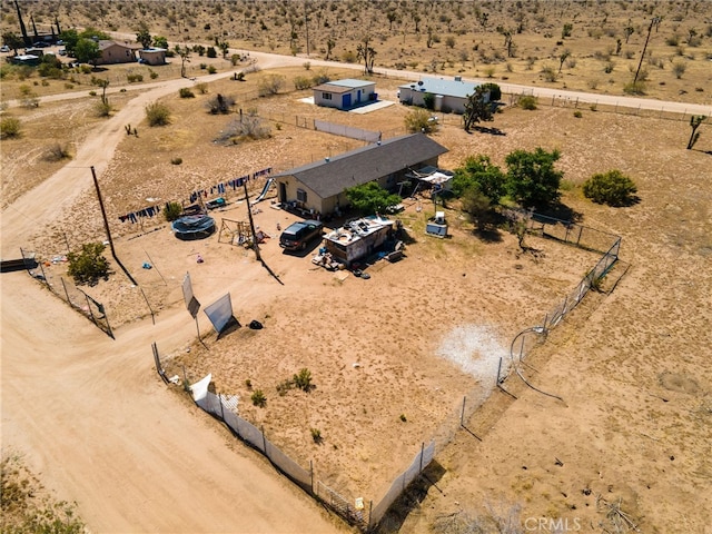 birds eye view of property with a rural view