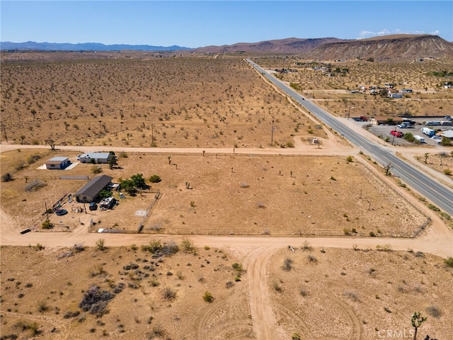 drone / aerial view featuring a mountain view