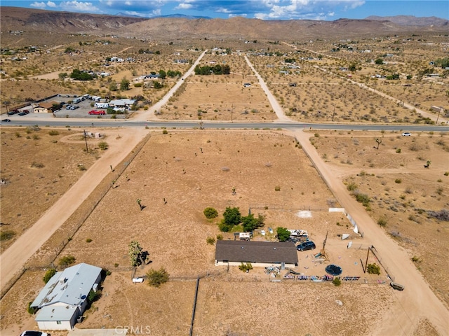 drone / aerial view with a mountain view and a rural view