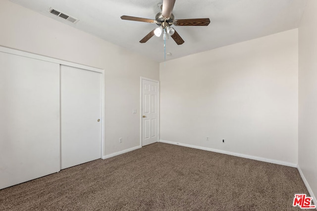 unfurnished bedroom with ceiling fan and carpet floors