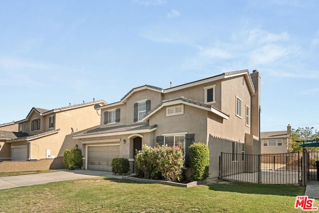 view of front of house with a garage and a front lawn