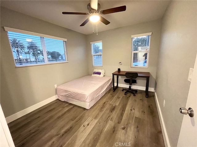 bedroom with hardwood / wood-style floors and ceiling fan