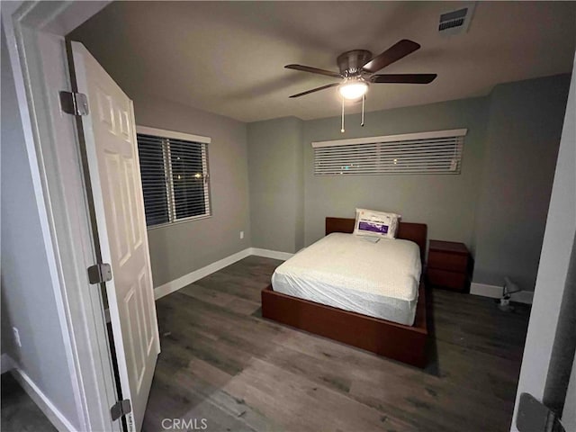 bedroom with dark wood-type flooring and ceiling fan