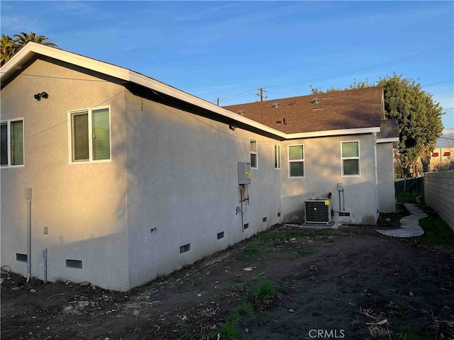 view of side of property with cooling unit