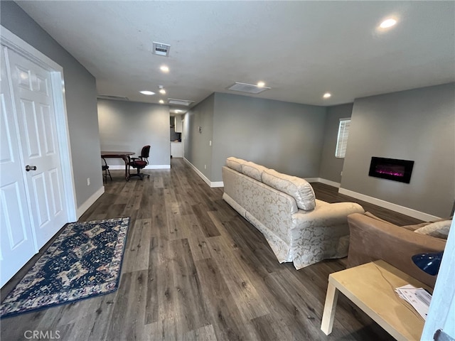 living room with dark hardwood / wood-style floors