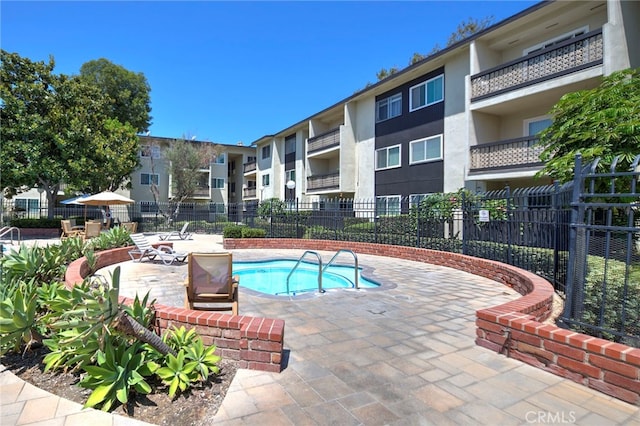 view of swimming pool with a patio