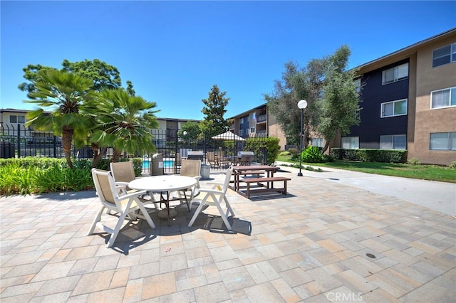 surrounding community with a patio area