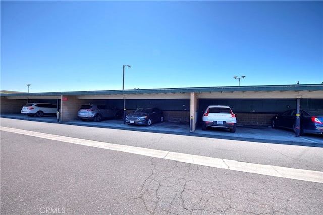 view of car parking featuring a carport