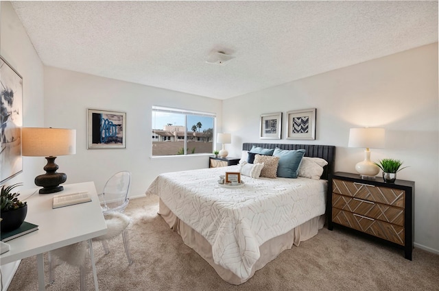 carpeted bedroom with a textured ceiling