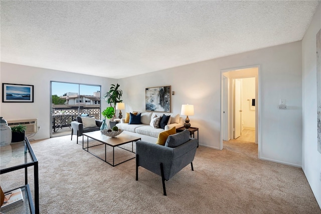 living room with a textured ceiling, a wall mounted AC, and light colored carpet