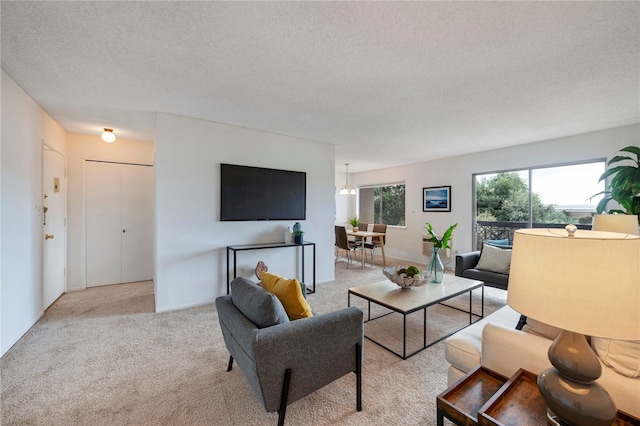 carpeted living room with a textured ceiling