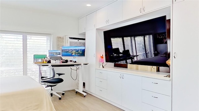 home office featuring light wood-style floors and recessed lighting