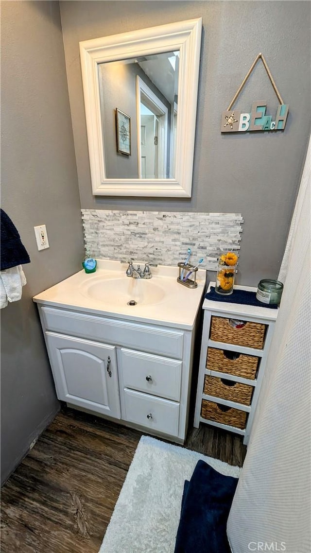 bathroom featuring vanity and wood-type flooring