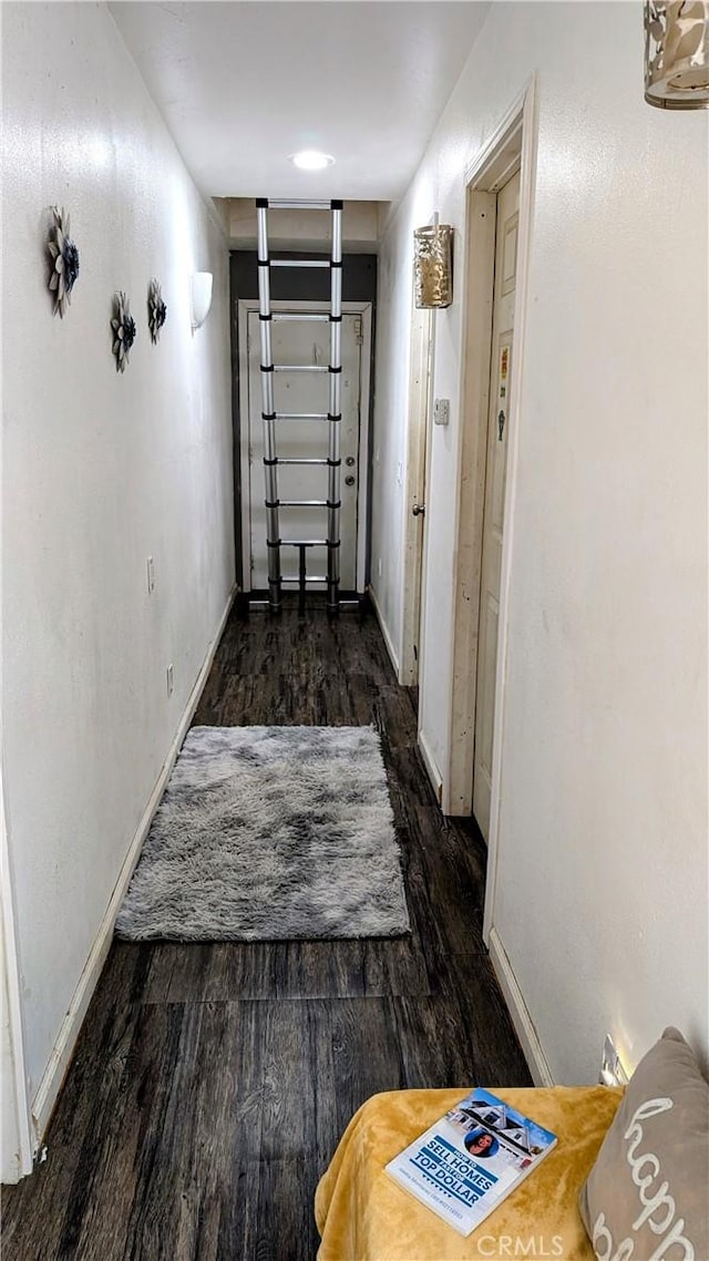 hallway featuring dark hardwood / wood-style floors