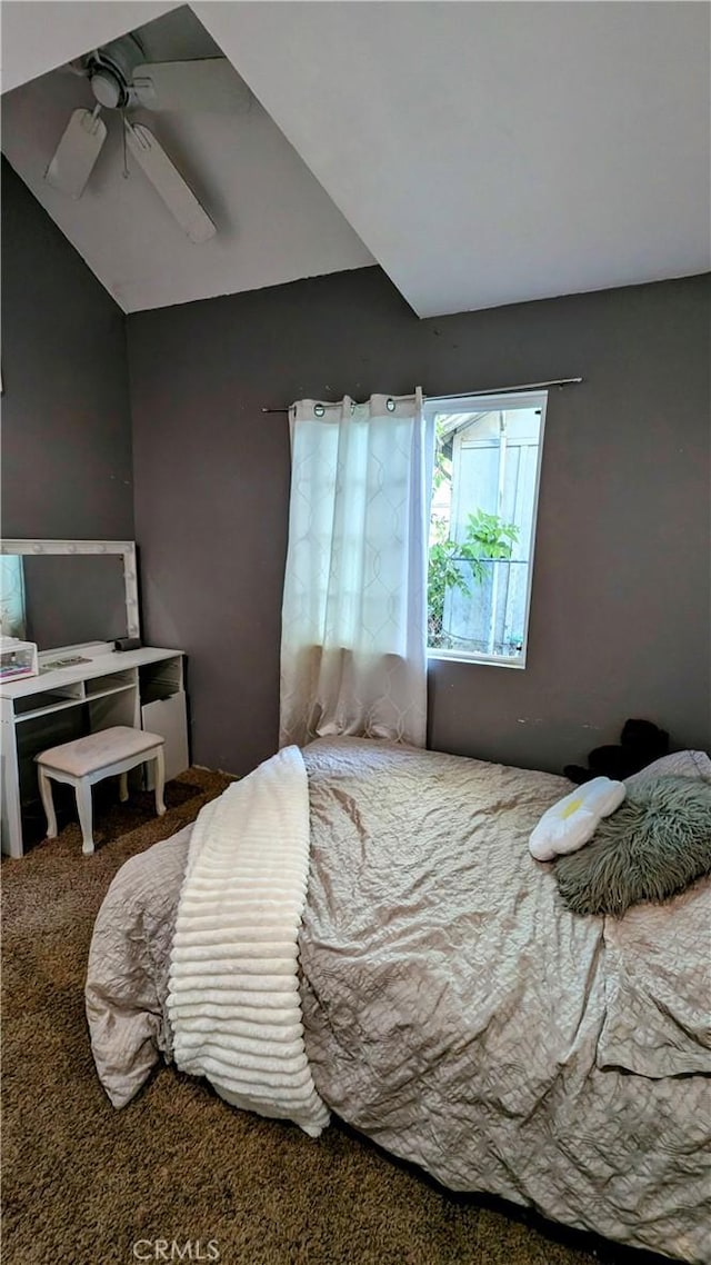 carpeted bedroom featuring ceiling fan and lofted ceiling