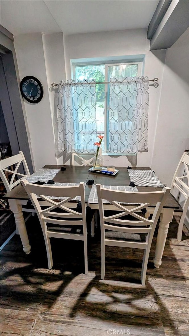 dining space featuring wood-type flooring