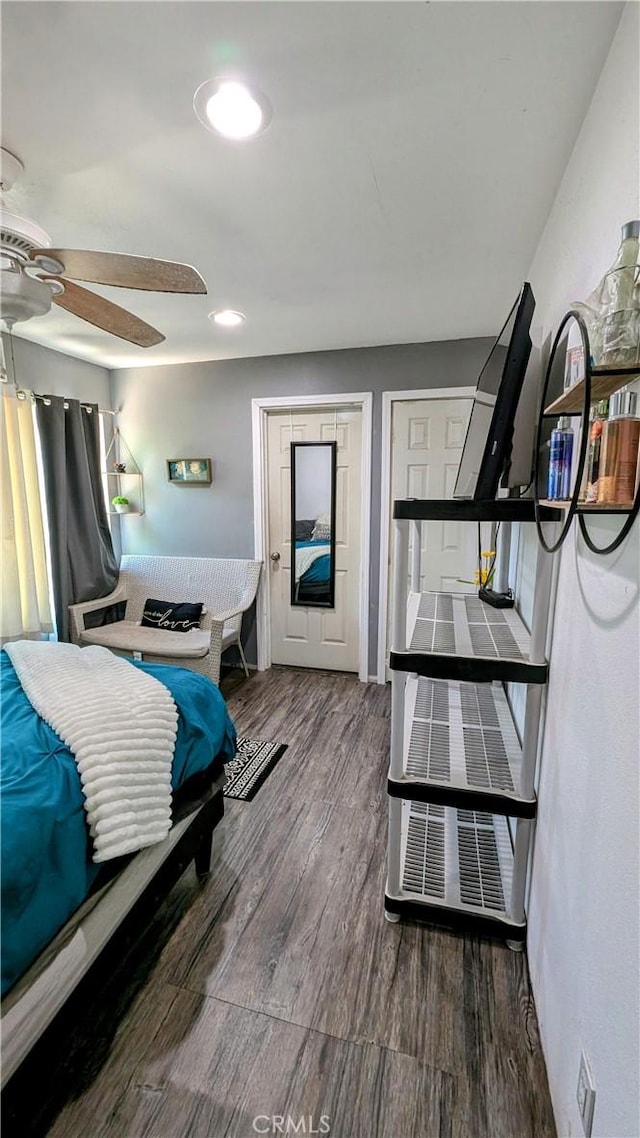 bedroom featuring ceiling fan and wood-type flooring