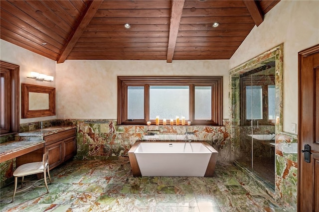 bathroom with vanity, tile walls, a tub to relax in, vaulted ceiling with beams, and wooden ceiling