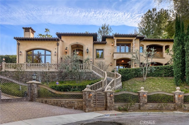 mediterranean / spanish home with a balcony