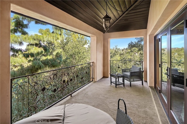 unfurnished sunroom featuring wooden ceiling