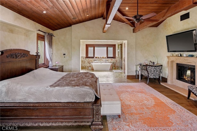 bedroom featuring wooden ceiling, vaulted ceiling with beams, dark hardwood / wood-style flooring, and a fireplace