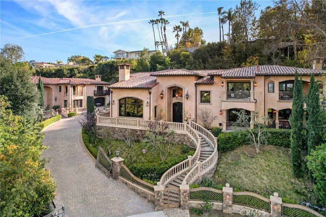 mediterranean / spanish-style house with a balcony