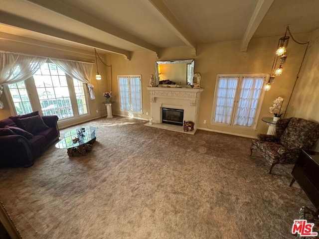 living room with beam ceiling and carpet floors