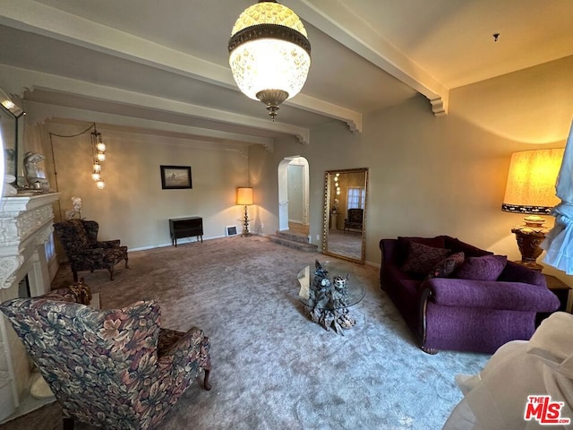 living room featuring beam ceiling and carpet floors