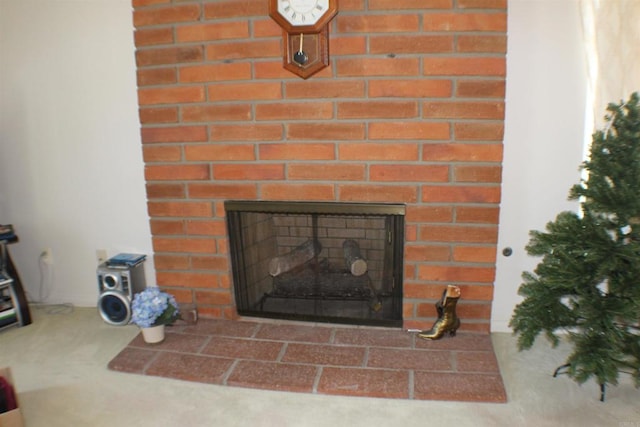 details featuring a brick fireplace and carpet floors