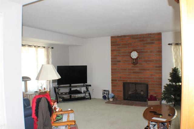 carpeted living room with a brick fireplace