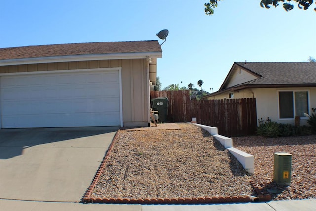 view of side of home with a garage