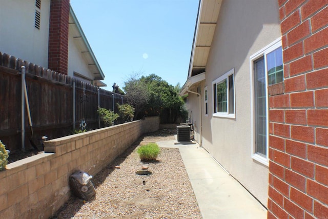 view of yard with central AC unit