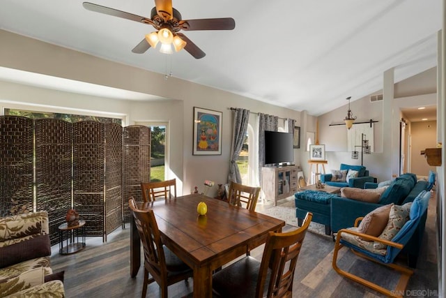 dining area featuring vaulted ceiling, ceiling fan, and dark hardwood / wood-style flooring