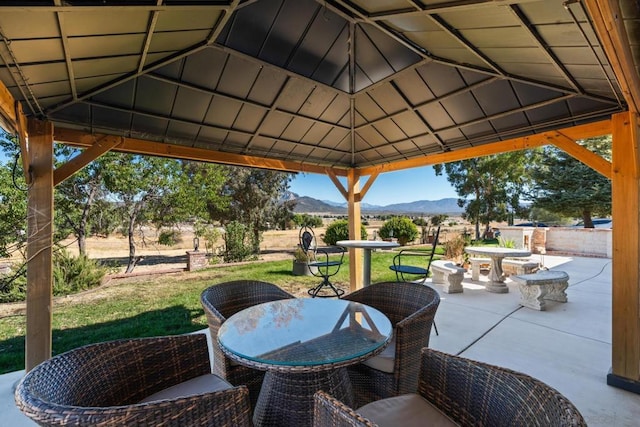 view of patio / terrace with a mountain view and a gazebo