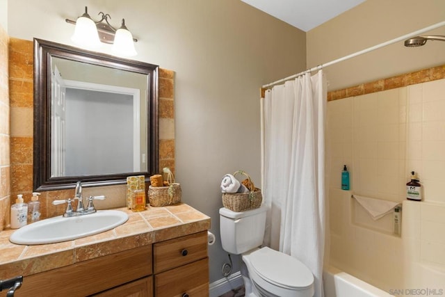 full bathroom with shower / bath combo, vanity, and toilet