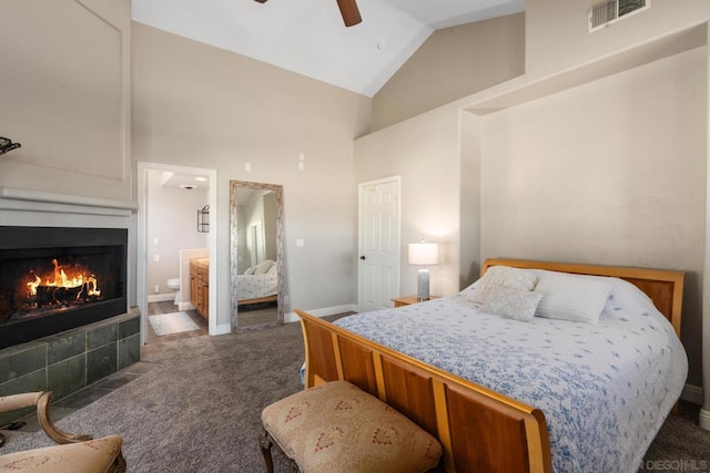 carpeted bedroom featuring ensuite bath, ceiling fan, and high vaulted ceiling