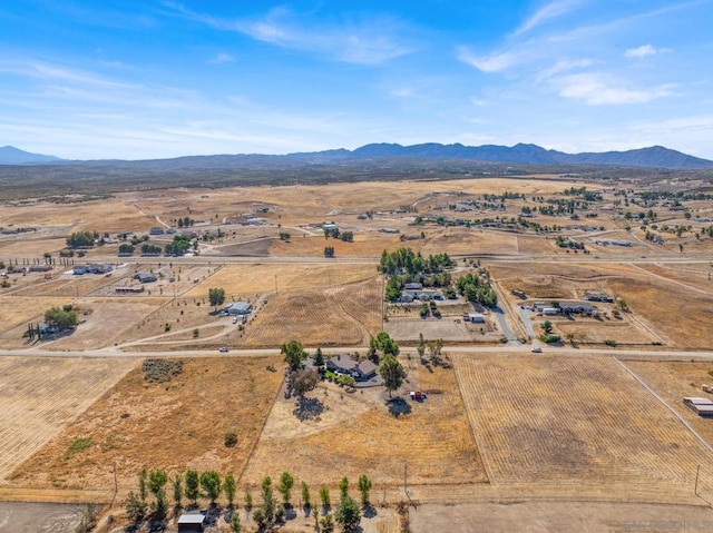 drone / aerial view featuring a mountain view and a rural view