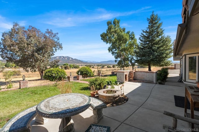 view of patio / terrace featuring a mountain view