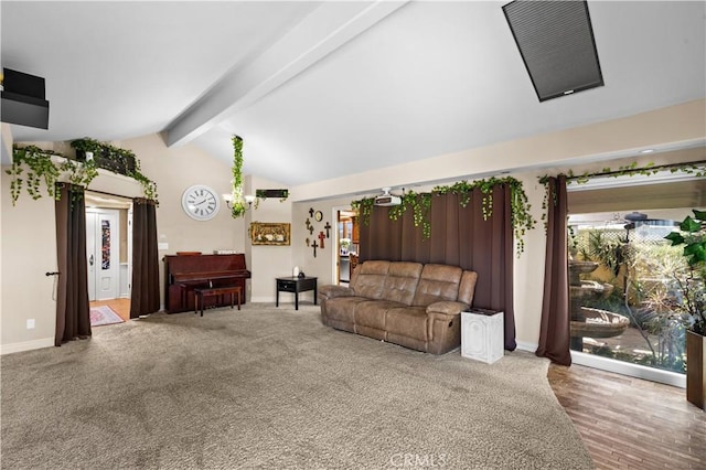 carpeted living room featuring a healthy amount of sunlight and lofted ceiling with beams