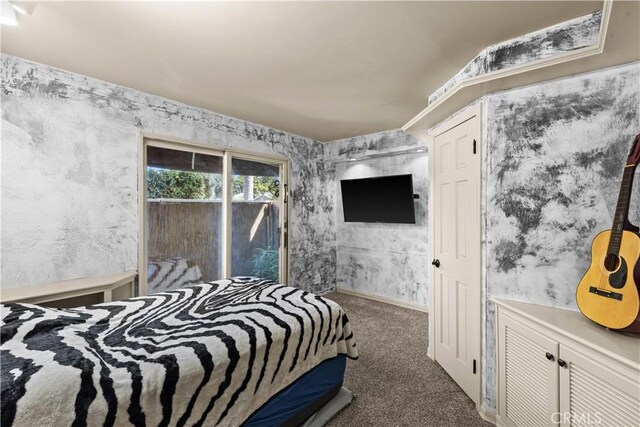 carpeted bedroom with access to exterior