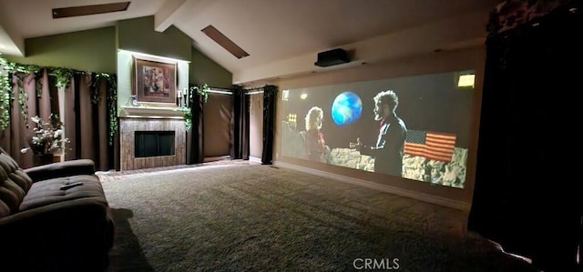 cinema with vaulted ceiling, a fireplace, and carpet floors