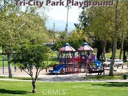 view of jungle gym featuring a lawn