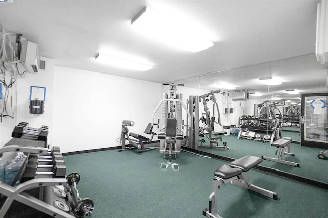 exercise room with a wall unit AC